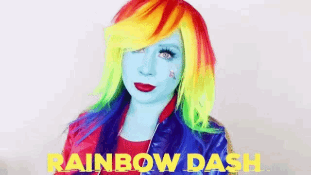 a woman in a rainbow dash costume is wearing a rainbow dash wig and jacket .