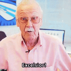 an elderly man in a pink shirt is saying excelsior
