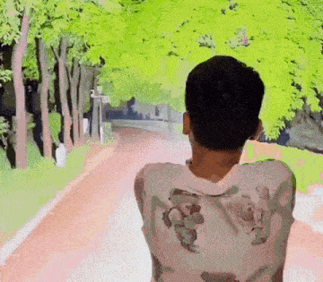 a man is walking down a path with trees on the side of the road .