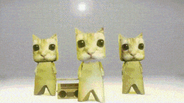 three paper cats are dancing in front of a boombox on a table