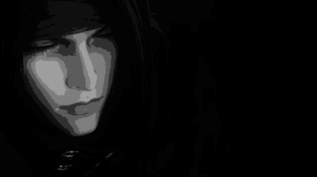 a close up of a person 's face in the dark .