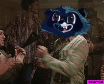 a man with a raccoon mask on his head is surrounded by other people