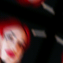 a blurry picture of a person 's face in a dark room .