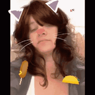 a woman with cat ears and a taco on her shoulder
