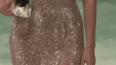 a close up of a woman 's chest in a sequined dress