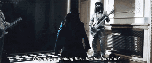 a man playing a guitar says " why are you making this harder than it is ? "