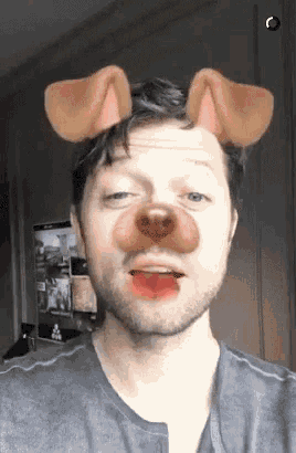 a man with a dog 's ears on his head