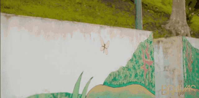 a painting of a butterfly on a wall with the word bragas on the bottom
