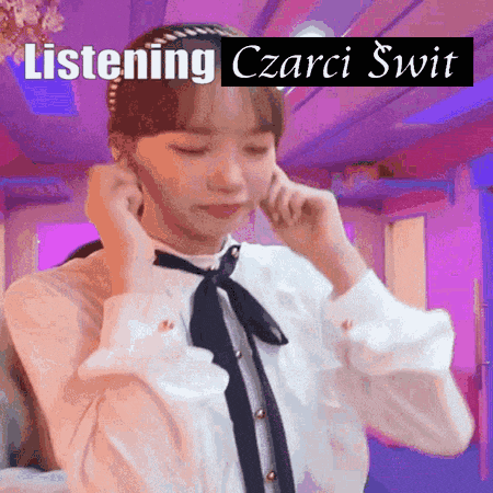 a woman wearing a white shirt and black tie is listening to a podcast