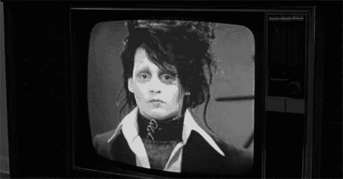 a black and white photo of a person on a tv screen