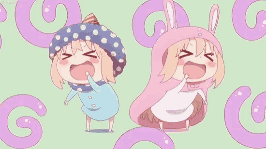 a couple of anime girls are standing next to each other and smiling .
