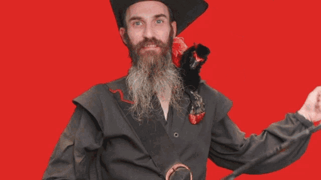 a man with a beard is holding a sword in front of a red background that says gheen