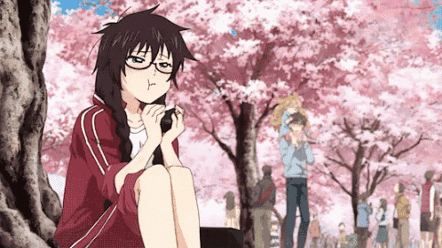a girl is sitting under a tree with cherry blossoms in the background