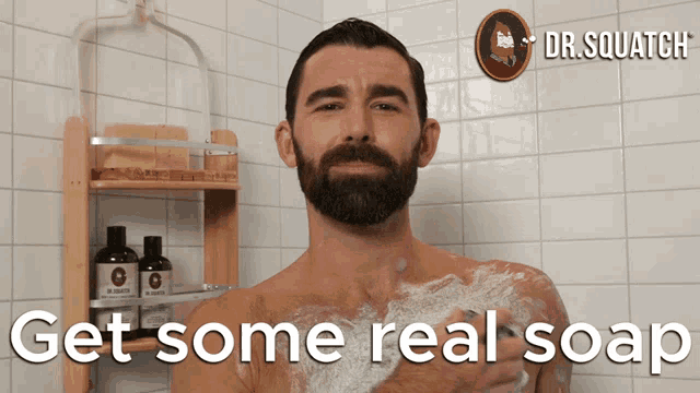 a man taking a shower with the words " get some real soap " below him