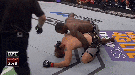 two men are wrestling in a ufc ring with the time of 2:49