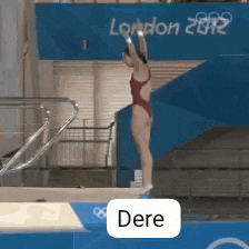 a woman in a red swimsuit is jumping into a pool at the london 2012 olympic games