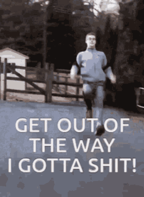 a man is running down a street with the words get out of the way i gotta shit