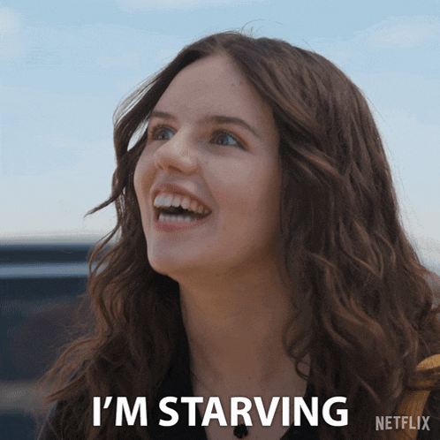 a woman is smiling and says " i 'm starving " in a netflix ad