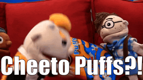 a cheeto puffs bag is being held by a puppet on a red couch