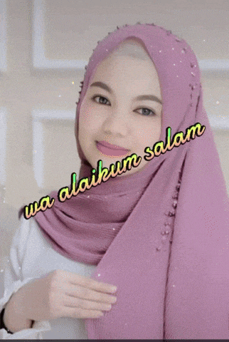 a woman wearing a purple hijab with wa alaikum salam written on the bottom
