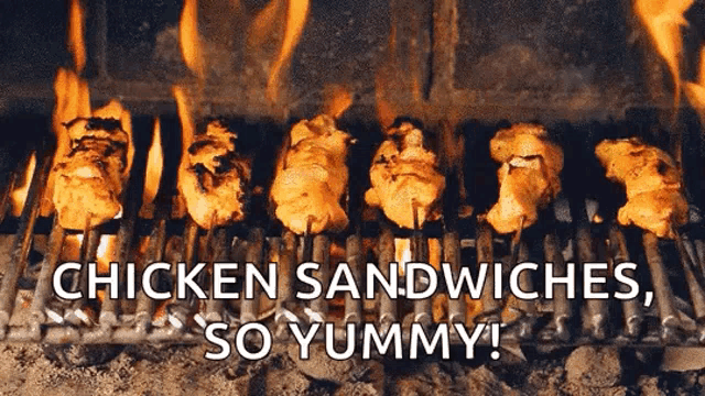 chicken sandwiches are being cooked on a grill