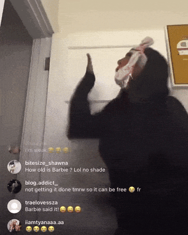 a woman with a bandage on her face is standing in front of a door with a bunch of comments on it