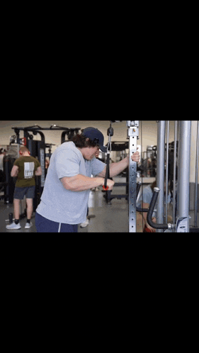 a man is doing exercises in a gym with the caption " me after that information "