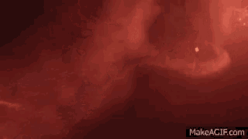 a red background with a glowing light coming out of it .
