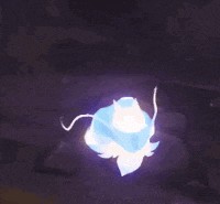 a blue flower is glowing in the dark in a dark room .