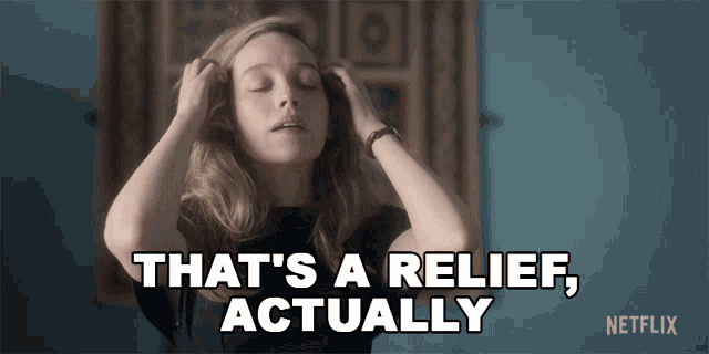 a woman is holding her head and says that 's a relief actually netflix