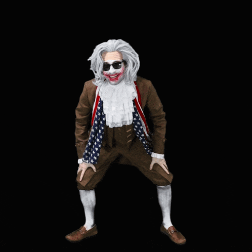 a man dressed as benjamin franklin is wearing a scarf with the american flag on it