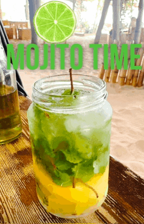 a picture of a mojito time drink with a slice of lime in it