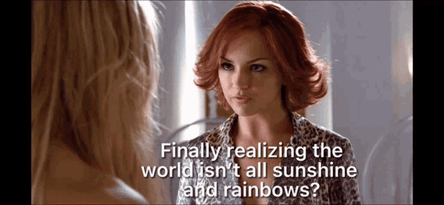 a woman with red hair says finally realizing the world isn't all sunshine and rainbows