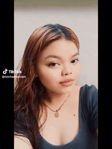 a woman 's face is shown in a tik tok video