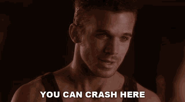 a man says " you can crash here " in front of a dark background