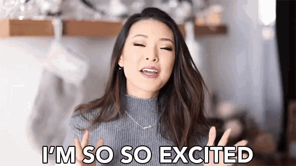 a woman in a sweater is making a funny face and saying `` i 'm so so excited '' .
