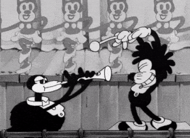 a black and white cartoon shows two monkeys playing instruments