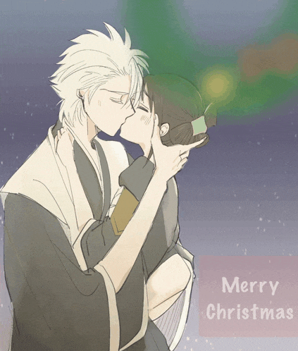 a couple kissing with the words merry christmas in the background