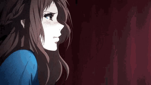 a girl with long brown hair is wearing a blue shirt and a braid .
