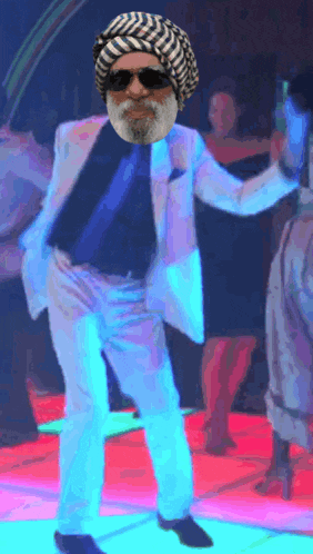 a man with a beard and sunglasses is dancing