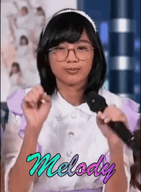 a girl in a maid costume is holding a microphone and the word melody is on the bottom of the picture