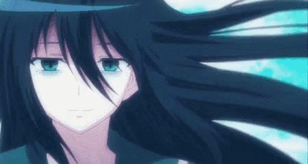 a girl with long black hair and blue eyes is looking at the camera .