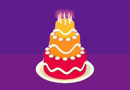 a colorful birthday cake with candles on top of it