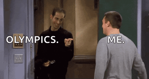 two men are standing next to each other and one of them is pointing at the other and says olympics .