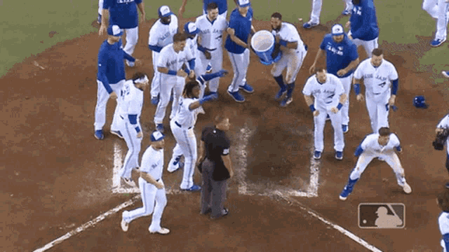a group of blue jays baseball players on a baseball field