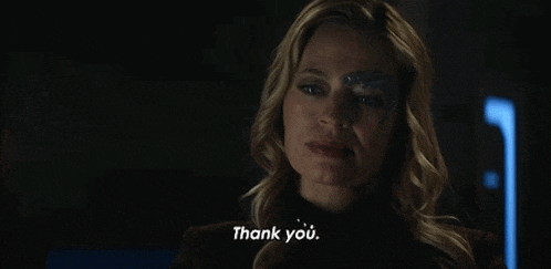 a woman with a robotic face is saying thank you