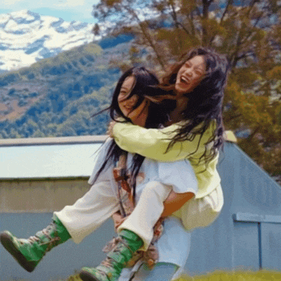 a woman is carrying another woman on her back