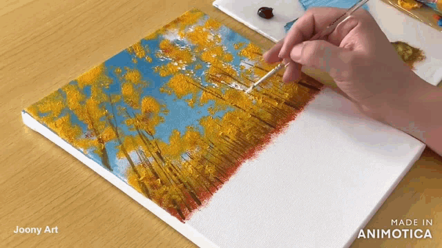 a painting of trees is being painted on a canvas made in animatica