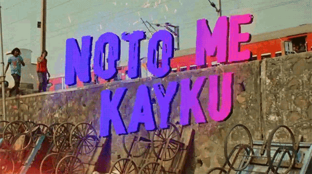 a sign that says " noto me kayku " on a wall