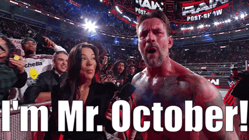 a man stands in front of a crowd with the words i 'm mr. october